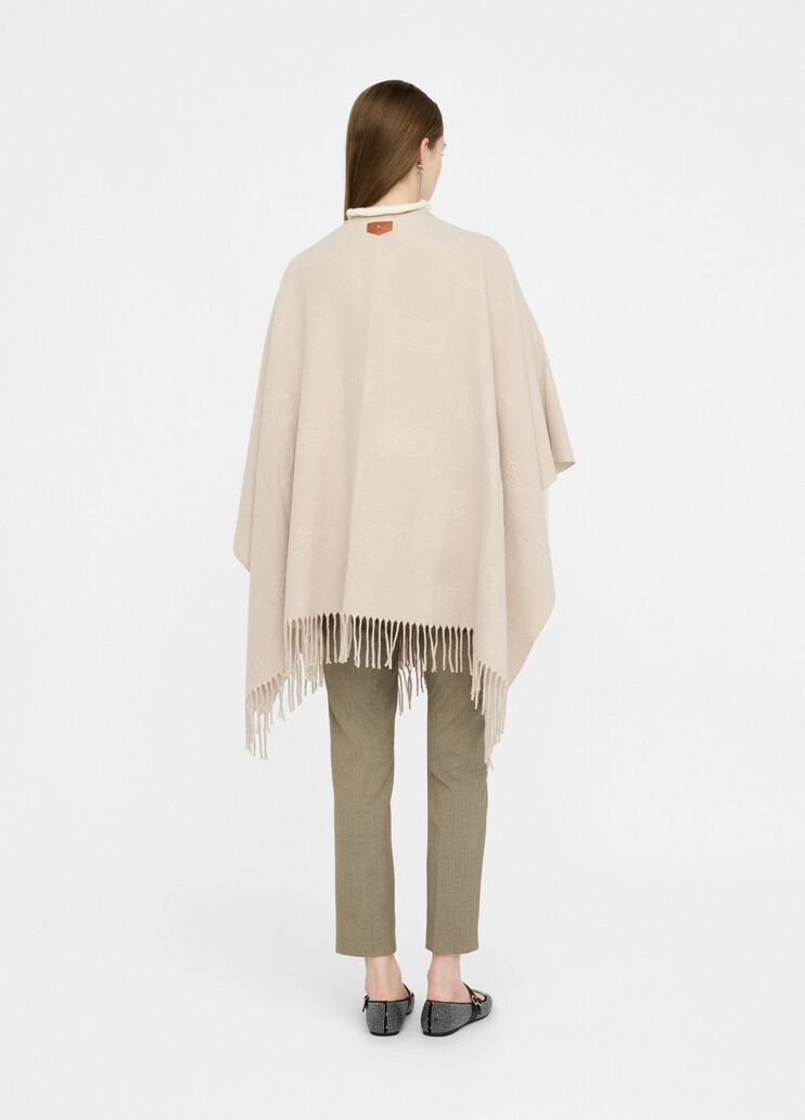 Poncho con logo e frange
