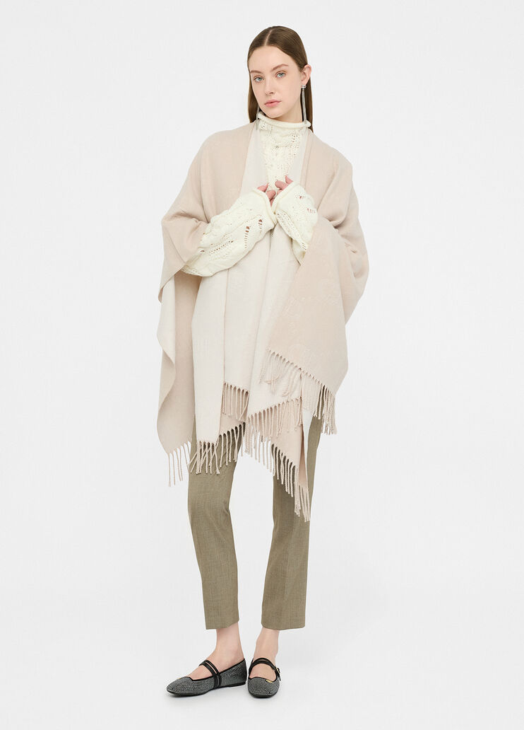 Poncho con logo e frange