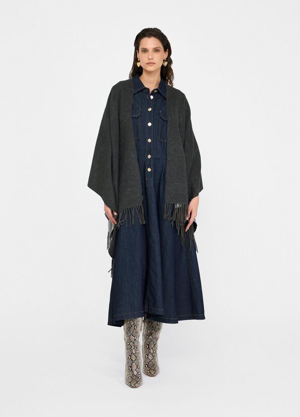 Poncho con logo e frange