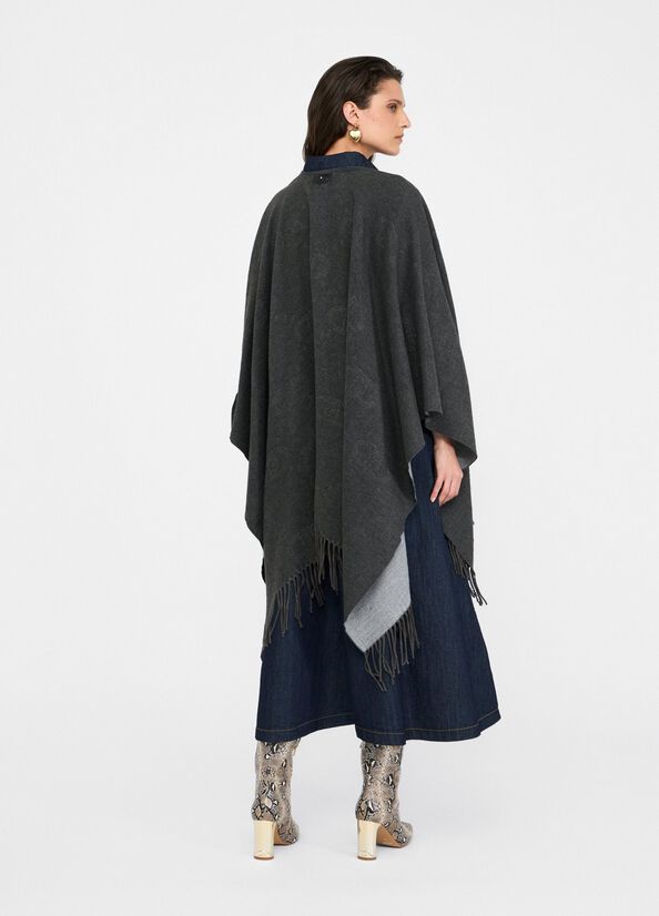 Poncho con logo e frange