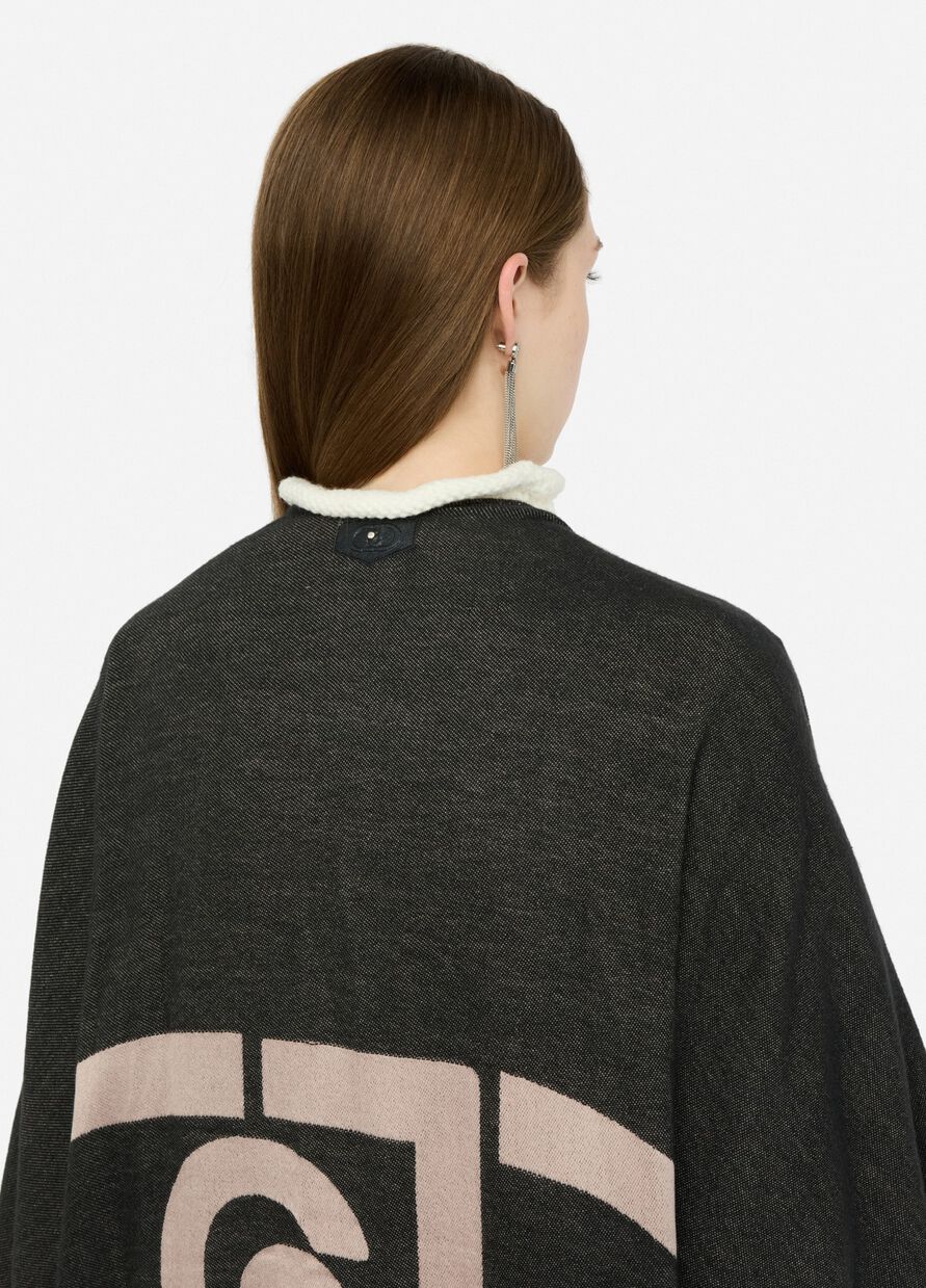 Poncho con logo e frange
